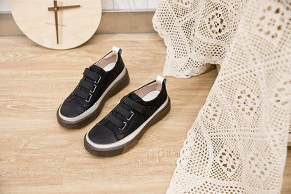 Stevvex women's black leather sneakers pair with velcro straps and thick white sole on Tampa Home & Garden Store