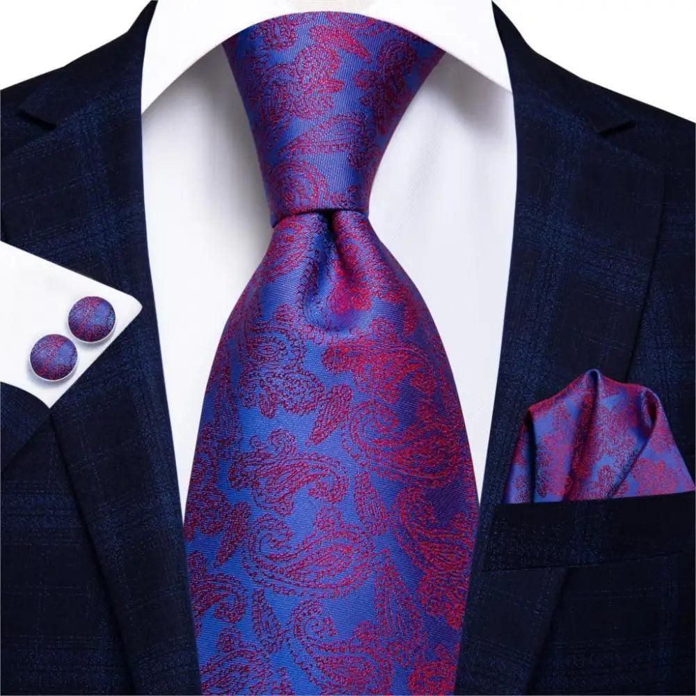 Stevvex silk necktie with blue-purple paisley print and pocket square cufflinks on navy suit on Tampa Home & Garden Store