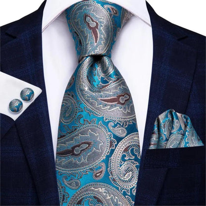 Stevvex silk necktie set with teal-silver paisley cufflinks and pocket square on navy suit on Tampa Home & Garden Store