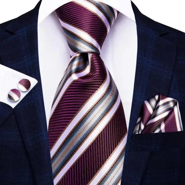 Silk burgundy striped necktie with matching pocket square and cufflinks on navy suit on Tampa Home & Garden Store