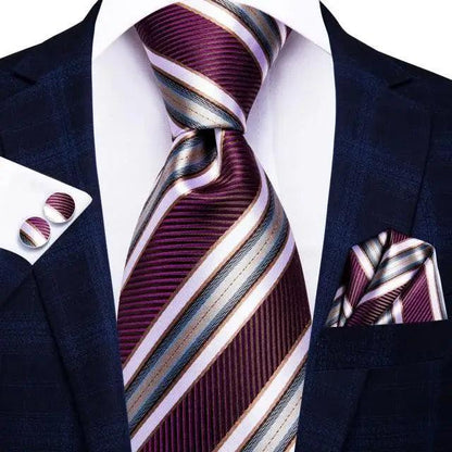 Silk burgundy striped necktie with matching pocket square and cufflinks on navy suit on Tampa Home & Garden Store