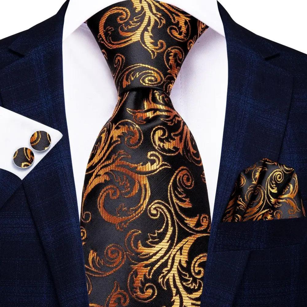 Silk necktie by Stevvex in black gold paisley print; matching pocket square and cufflinks on Tampa Home & Garden Store