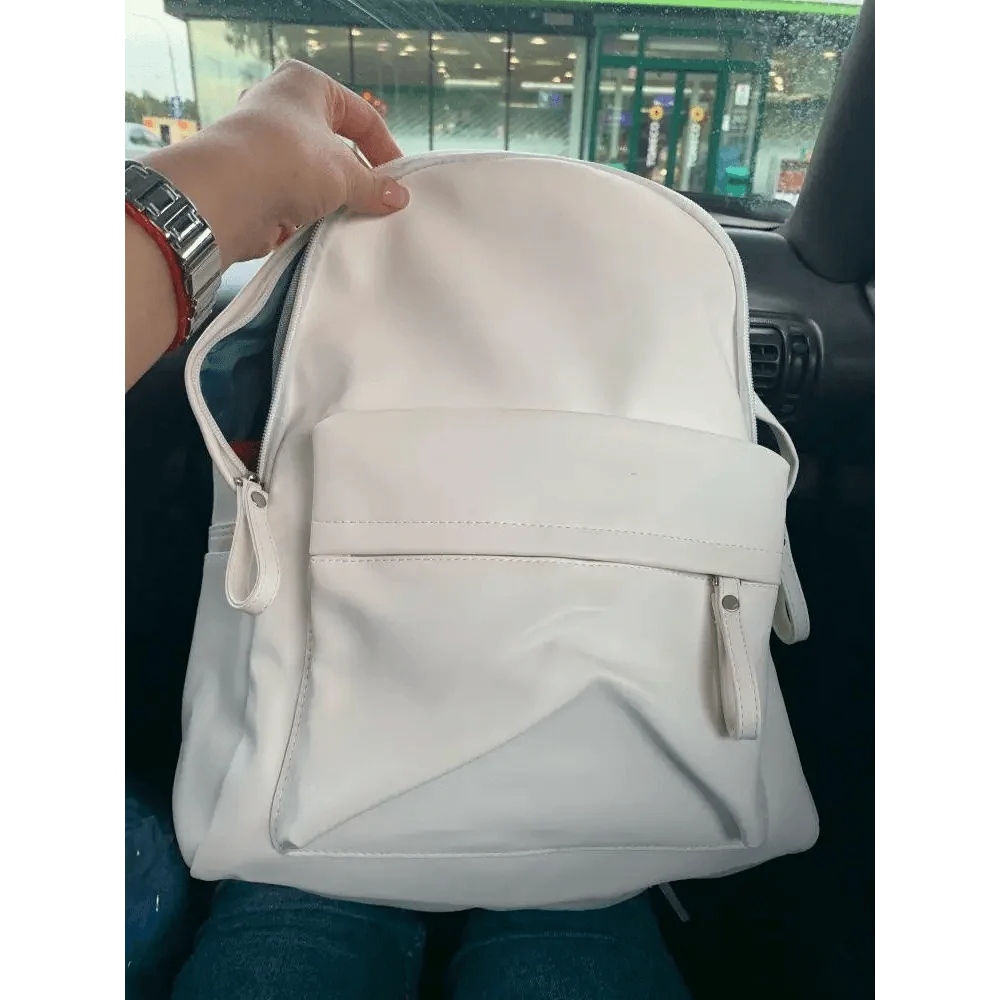 White Stevvex PU leather backpack with front zip pocket and diagonal panel detail on Tampa Home & Garden Store