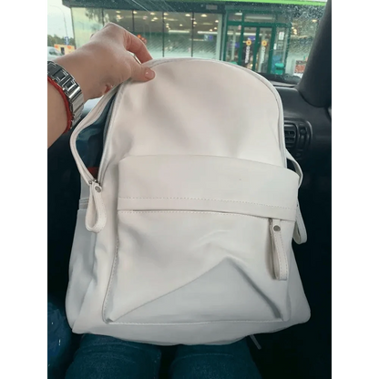 White Stevvex PU leather backpack with front zip pocket and diagonal panel detail on Tampa Home & Garden Store