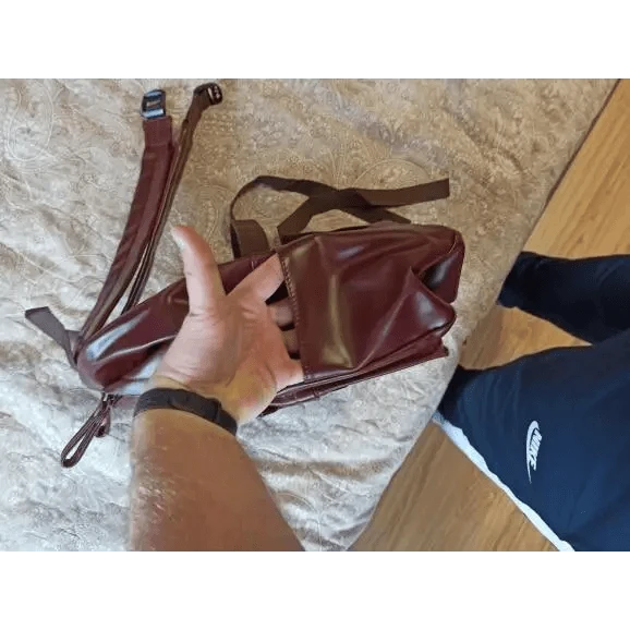 Backpack burgundy PU leather travel backpack with large capacity for teens, held in hand on Tampa Home & Garden Store
