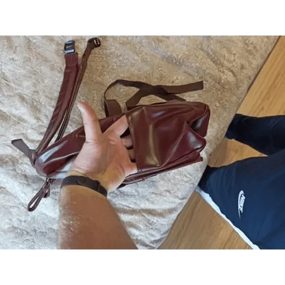 Backpack burgundy PU leather travel backpack with large capacity for teens, held in hand on Tampa Home & Garden Store