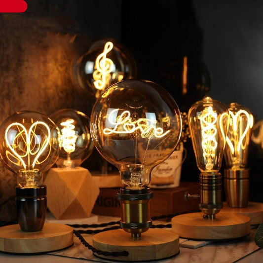 Stevvex LED Edison bulbs with warm white filament forming letters, lamp on wood base on Tampa Home & Garden Store