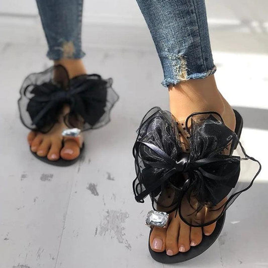 Stevvex bow sandals pair with rhinestone toe strap and black bow, non-slip rubber sole on Tampa Home & Garden Store