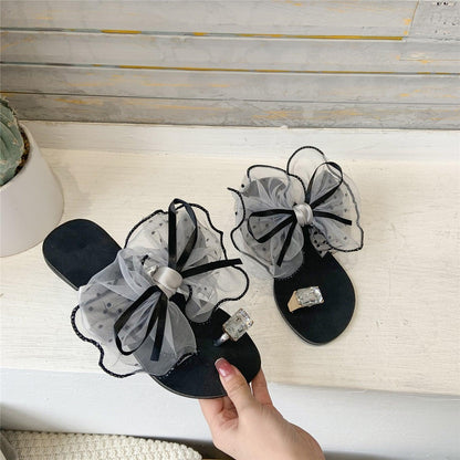 Stevvex black sandals with oversized gray tulle bows and crystal-embellished straps on Tampa Home & Garden Store