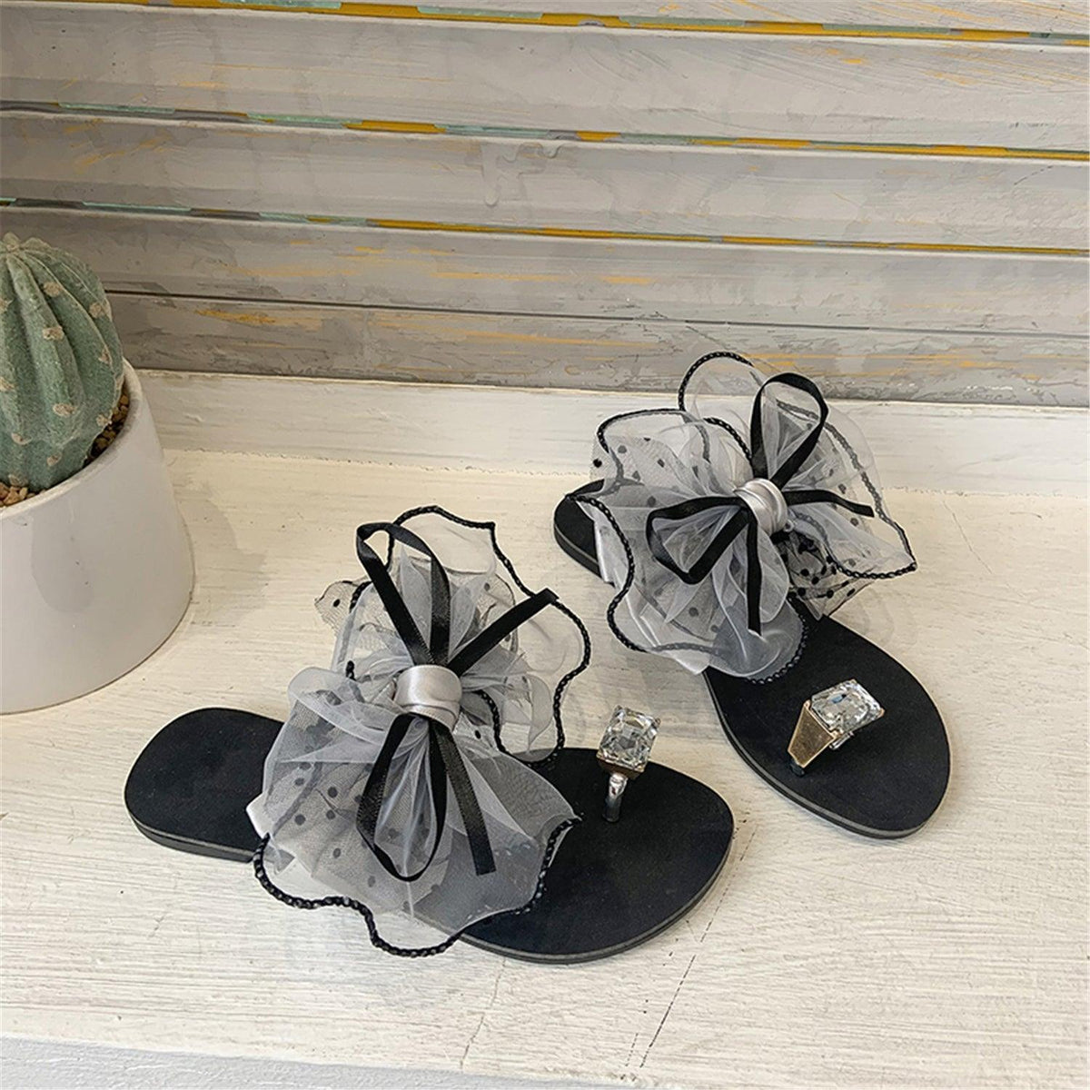 Sandals by Stevvex black flat with sheer gray bow, black trim, rhinestone center rubber sole on Tampa Home & Garden Store