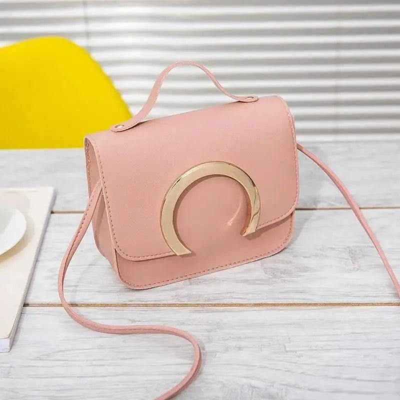 Stevvex pink PU leather crossbody bag with gold circular hardware, women's handbag on Tampa Home & Garden Store