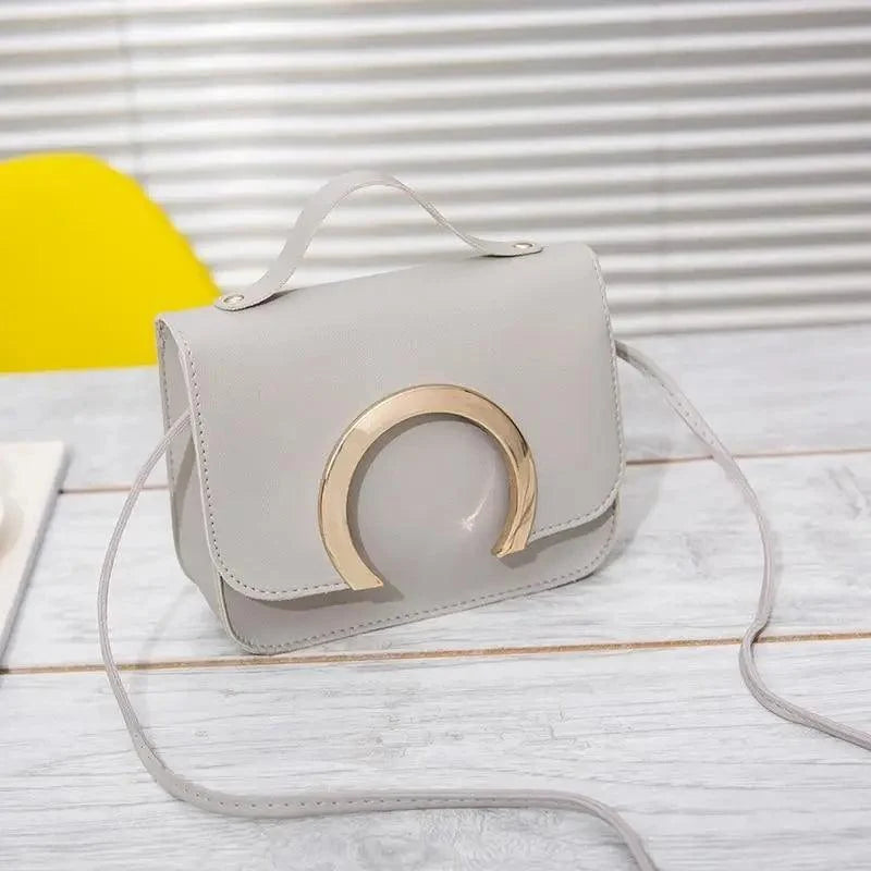 Stevvex crossbody bag in grey PU leather with gold crescent hardware, women's handbag on Tampa Home & Garden Store