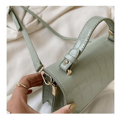 Stevvex crocodile-embossed crossbody bag in sage green with gold hardware on Tampa Home & Garden Store