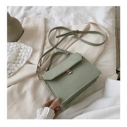 Crossbody bag Stevvex in sage green croc-embossed PU leather with flap and gold clasp on Tampa Home & Garden Store