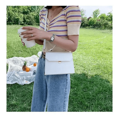 Stevvex white PU leather crossbody bag, small evening handbag with gold turn-lock clasp on Tampa Home & Garden Store