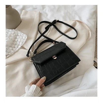 Crossbody bag Stevvex black crocodile-textured PU leather with front flap and gold turn-lock on Tampa Home & Garden Store
