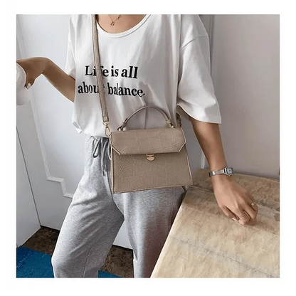 Stevvex crossbody bag in beige crocodile-embossed PU leather with top handle and adjustable crossbody strap on Tampa Home & Garden Store