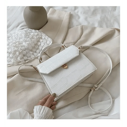 White croc-embossed crossbody bag by Stevvex with front flap; small PU leather evening handbag on Tampa Home & Garden Store