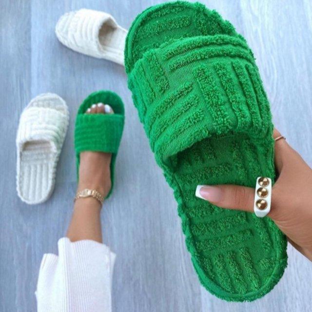 Stevvex green plush memory-foam house slippers; slide-on style with a white pair visible on Tampa Home & Garden Store