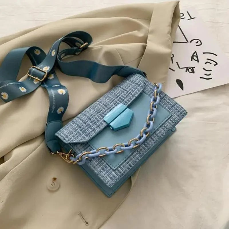 Stevvex shoulder bag in blue tweed with light blue chain strap and daisy-printed strap on Tampa Home & Garden Store