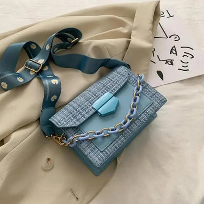 Stevvex shoulder bag in blue tweed with light blue chain strap and daisy-printed strap on Tampa Home & Garden Store