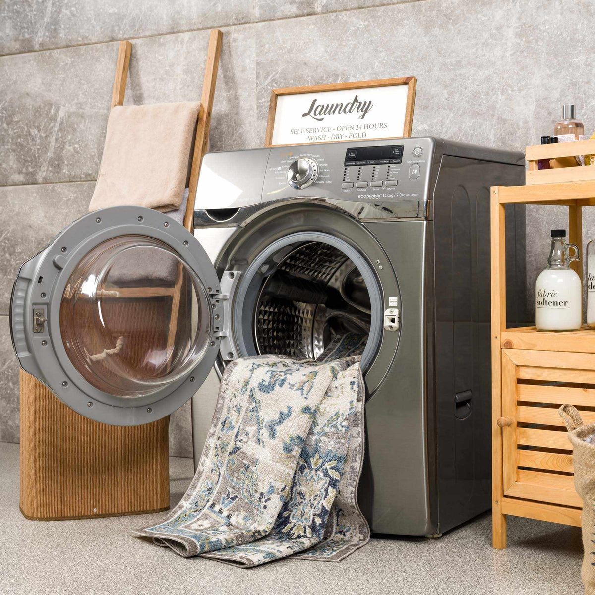 Cabacungan gray & blue washable area rug by Boutique Rugs, draped over a front-loading washer on Tampa Home & Garden Store