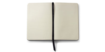 Medium Midnight Blue Journal by A.T. Cross, open with cream ruled pages and black ribbon on Tampa Home & Garden Store