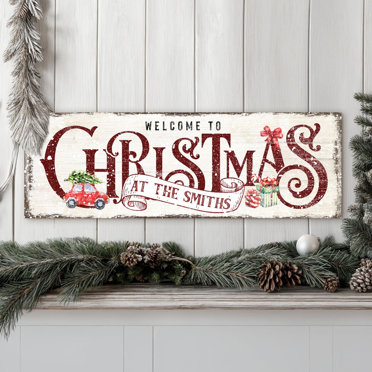 Canvas Family Welcome To Christmas Sign II with red lettering and pine garland on Tampa Home & Garden Store