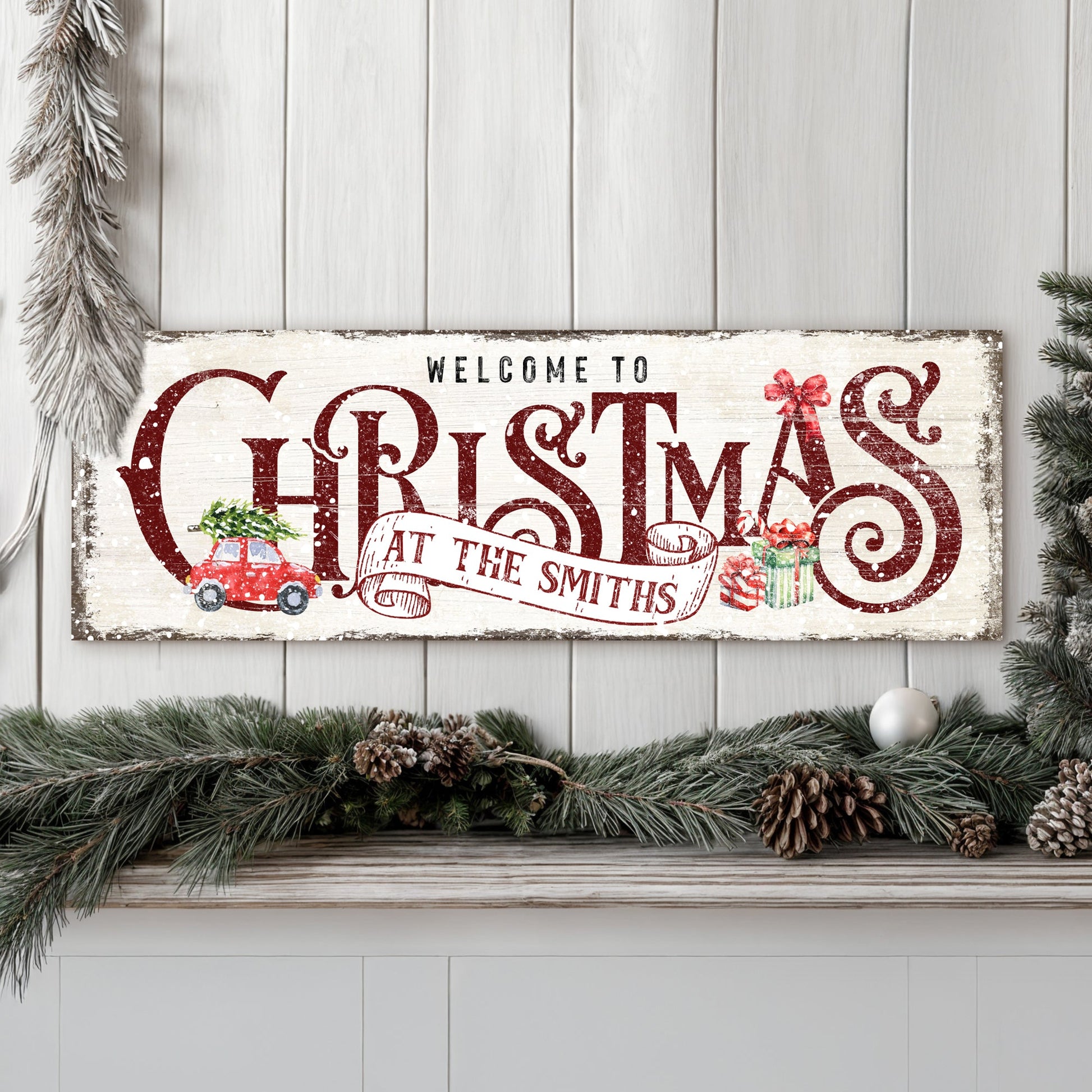 Canvas Family Welcome To Christmas Sign II with red lettering and pine garland on Tampa Home & Garden Store