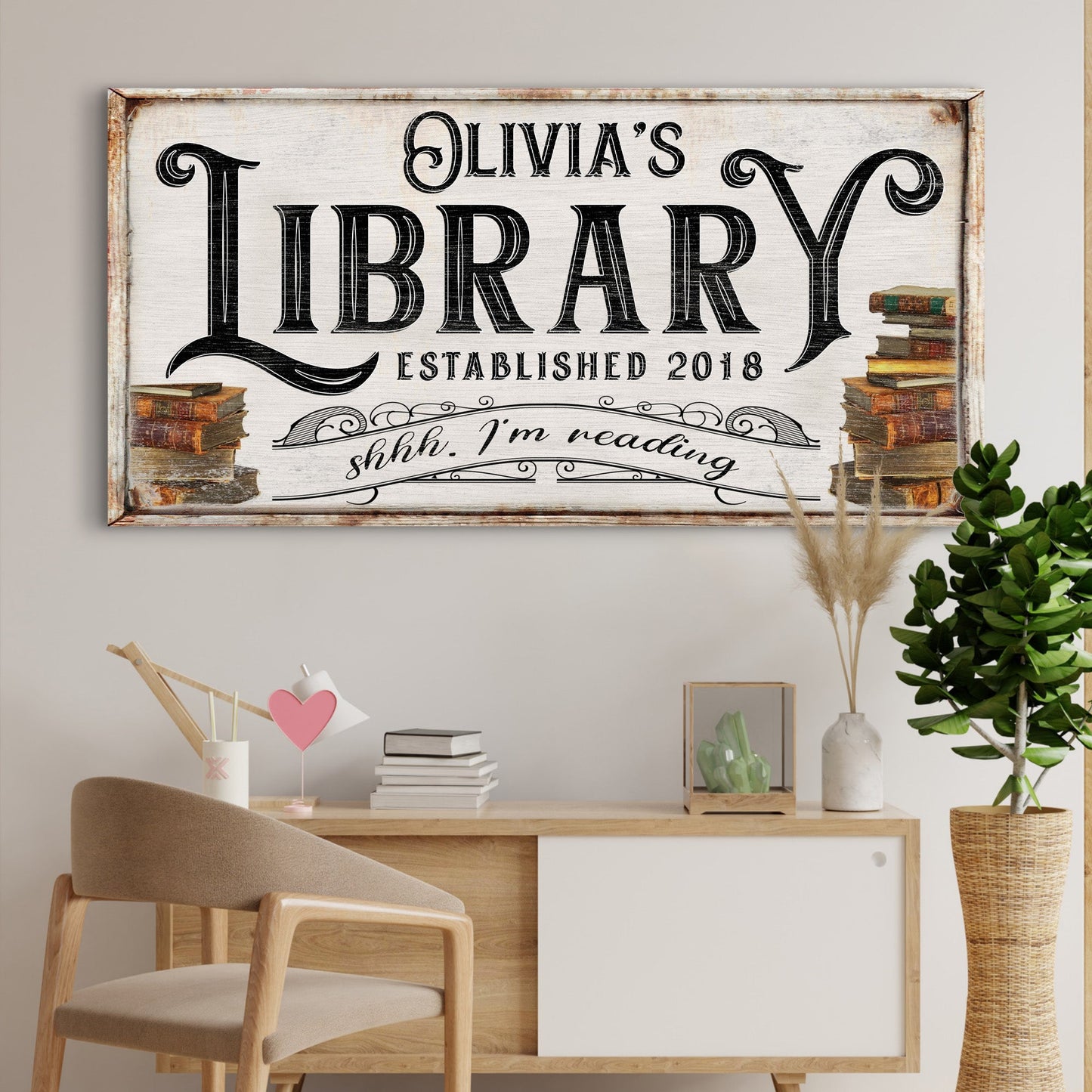 Shhh I'm Reading Library Sign canvas with Olivia's Library typography and book stacks on Tampa Home & Garden Store