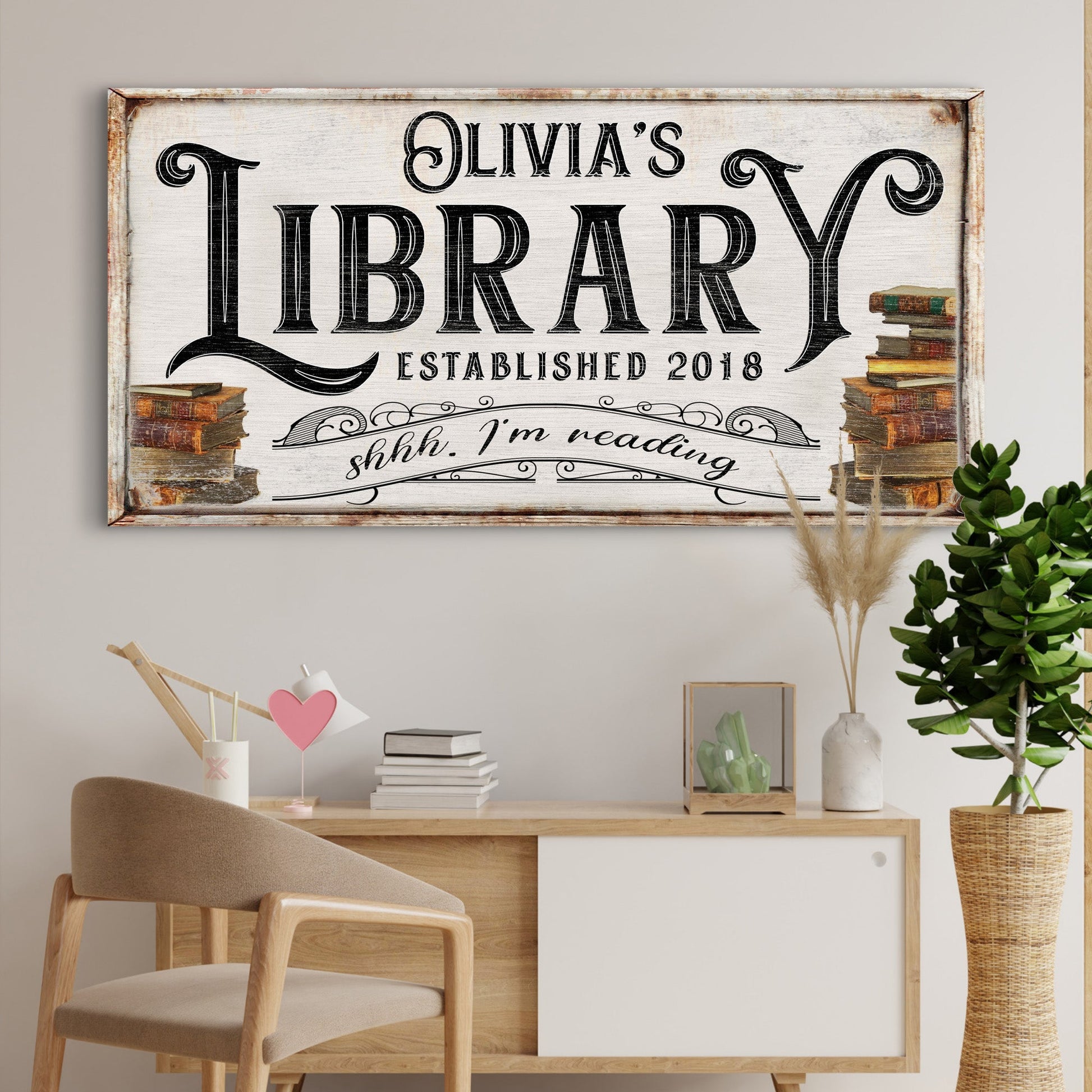 Shhh I'm Reading Library Sign canvas with Olivia's Library typography and book stacks on Tampa Home & Garden Store