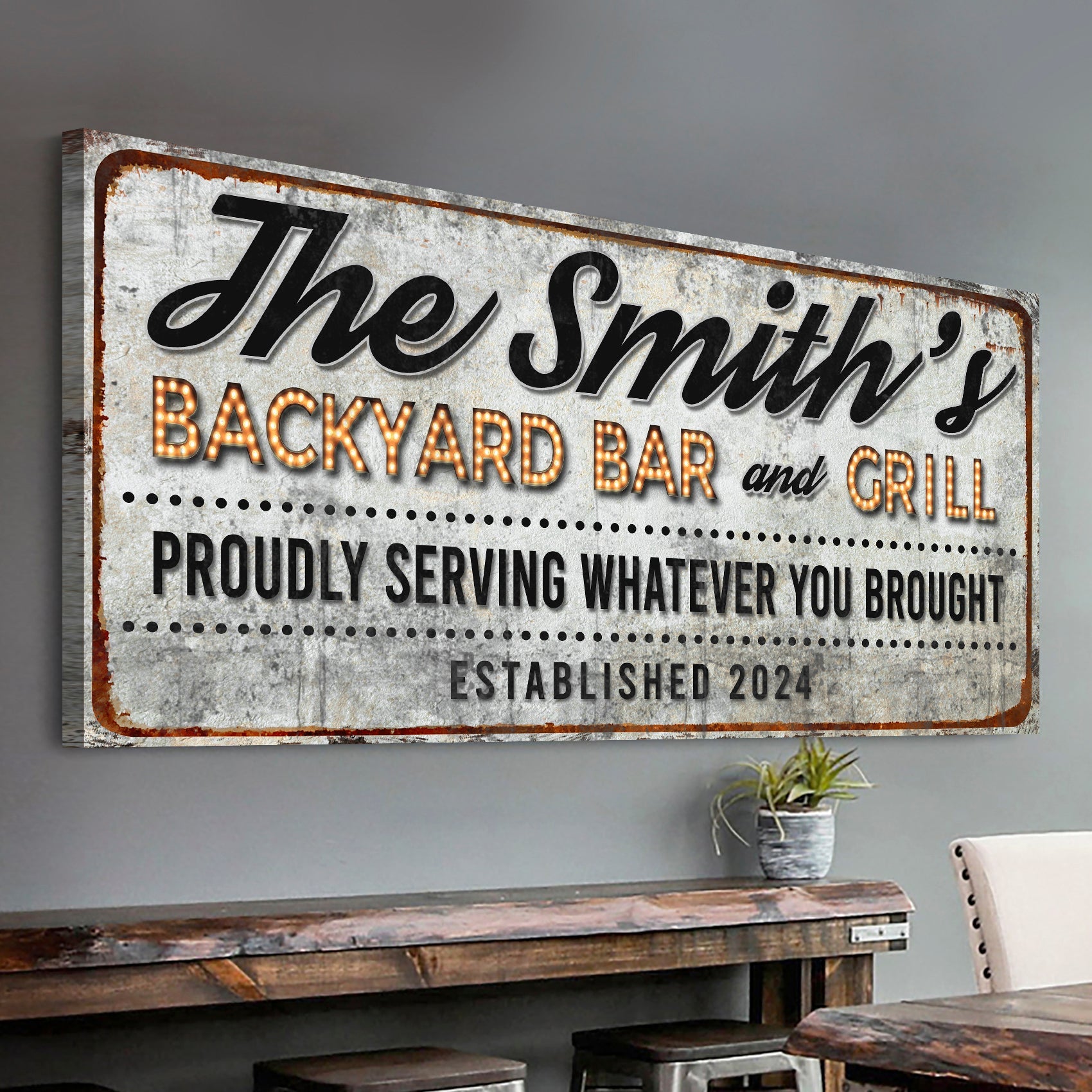 Canvas sign The Smith's Backyard Bar and Grill with rusted edge and illuminated marquee letters on Tampa Home & Garden Store