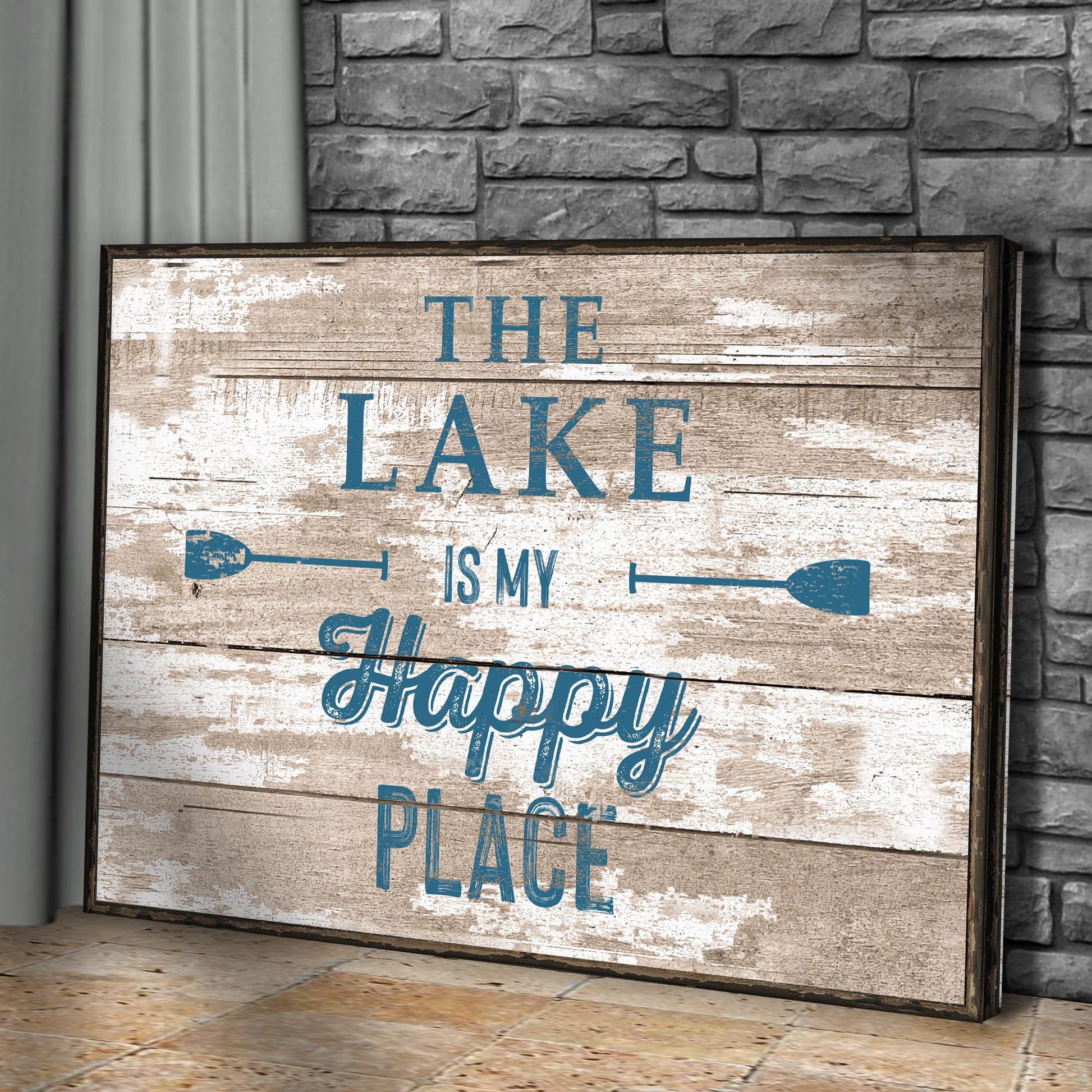 Canvas sign The Lake Is My Happy Place III with beige wood and blue lettering on a dark frame on Tampa Home & Garden Store