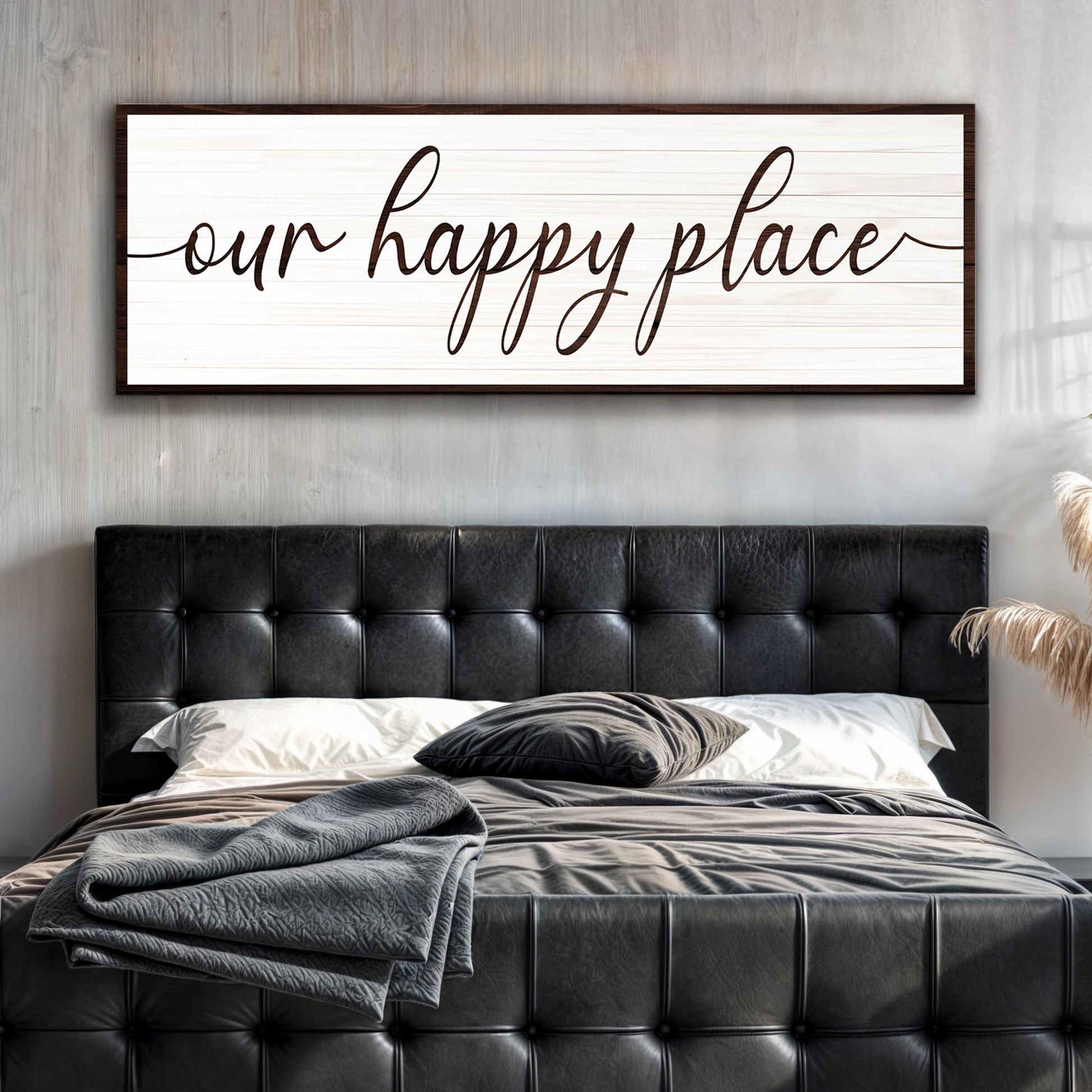 Our Happy Place Sign II canvas by Tailored Canvases, white plank with dark frame above bed on Tampa Home & Garden Store