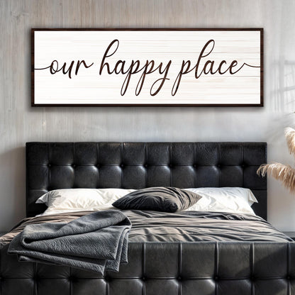 Our Happy Place Sign II canvas by Tailored Canvases, white plank with dark frame above bed on Tampa Home & Garden Store