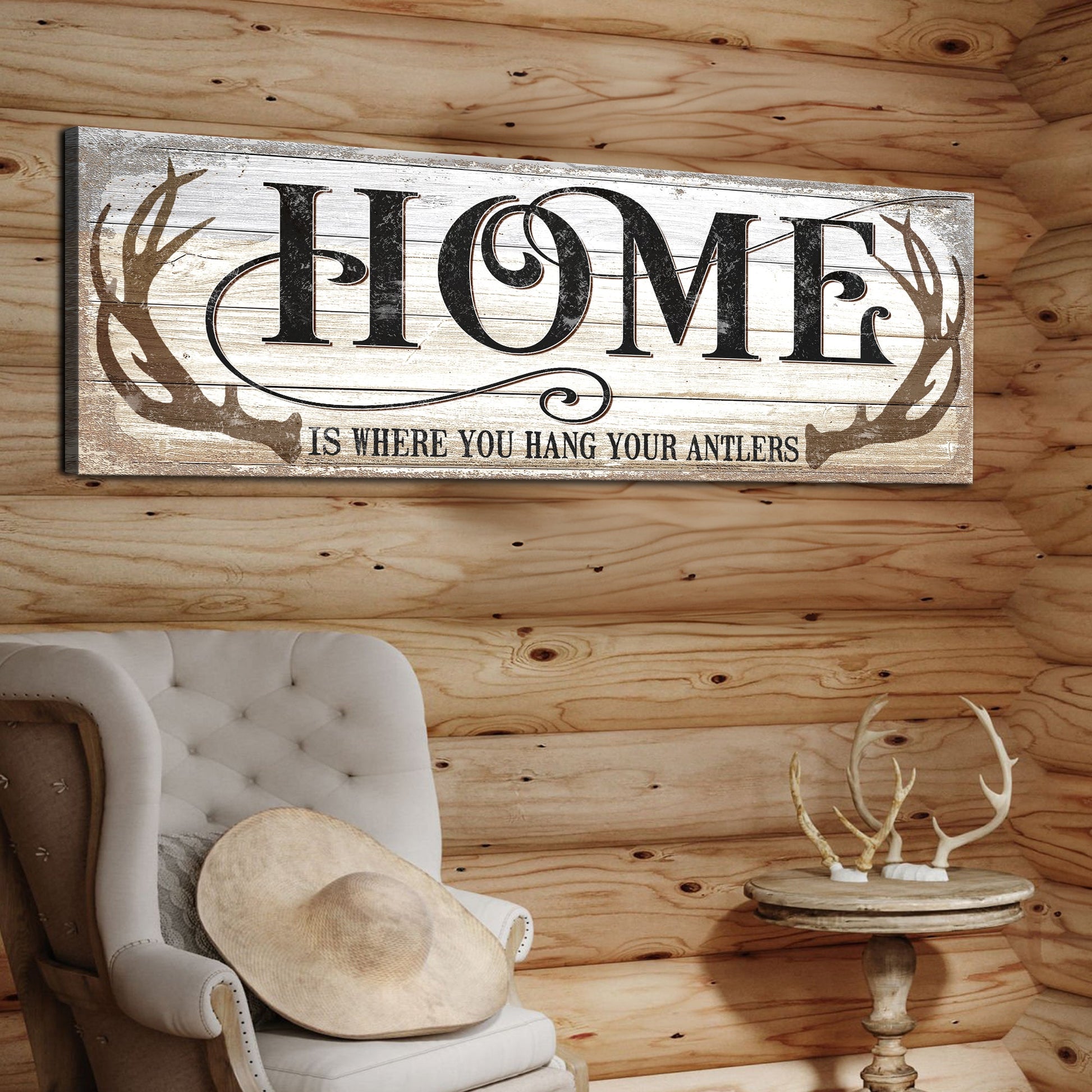 Home Is Where You Hang Your Antlers canvas sign with whitewashed wood and antler motif on Tampa Home & Garden Store