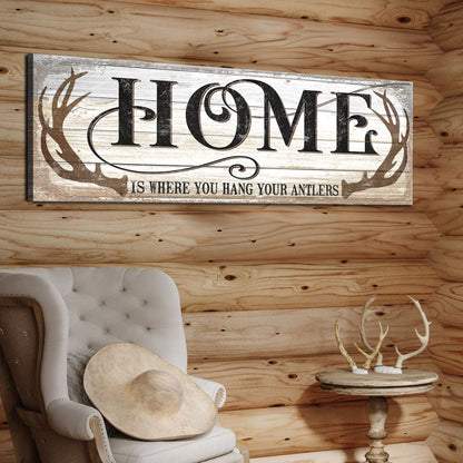 Home Is Where You Hang Your Antlers canvas sign with whitewashed wood and antler motif on Tampa Home & Garden Store
