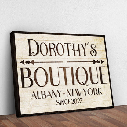 Boutique Sign IV canvas with vintage beige aged-paper look and dark wood frame, bold serif lettering on Tampa Home & Garden Store