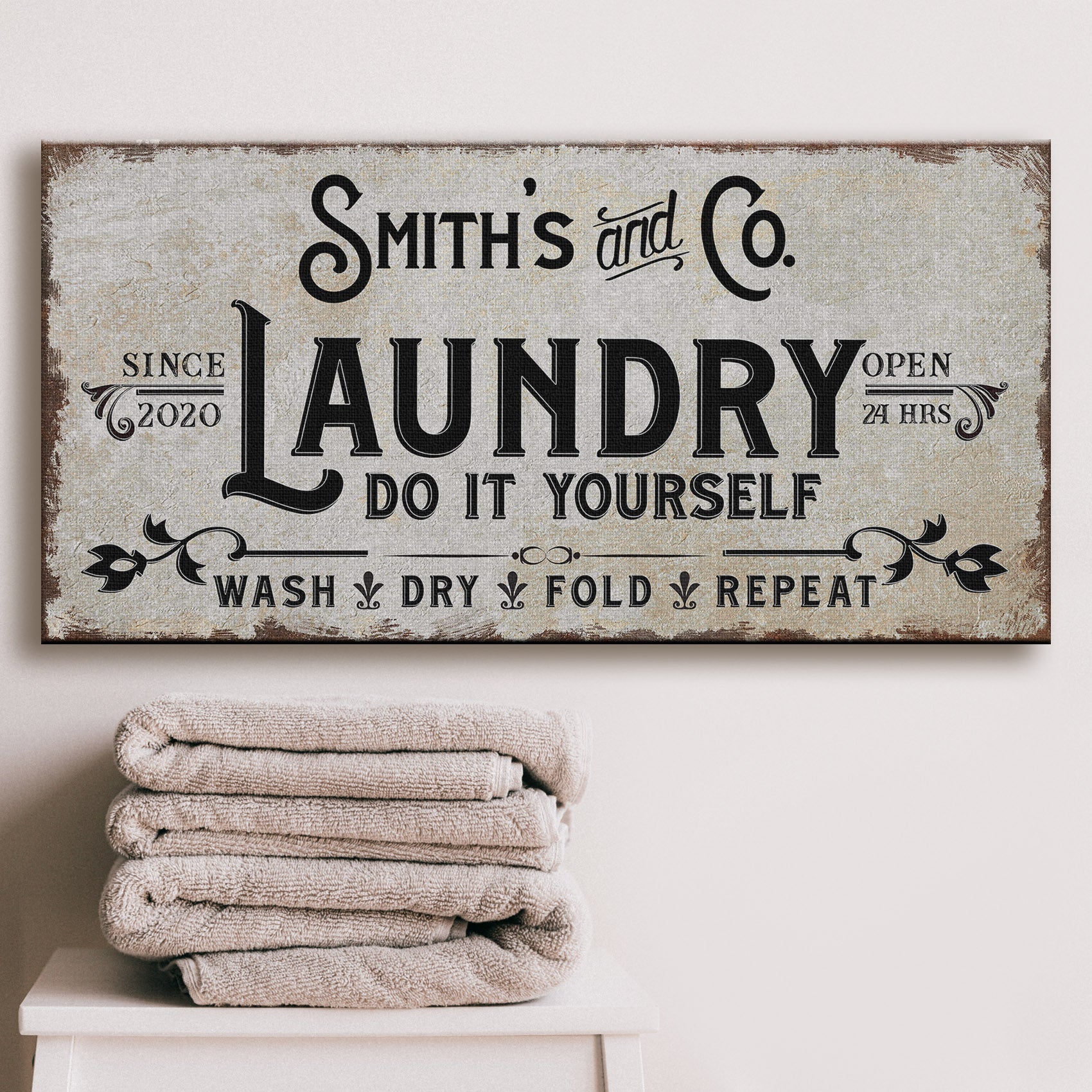 Laundry Room Sign ll canvas with distressed beige backdrop and bold black typography on Tampa Home & Garden Store