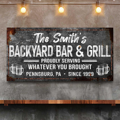Canvas Backyard Bar & Grill Sign XXIII by Tailored Canvases with black sign and white lettering on Tampa Home & Garden Store