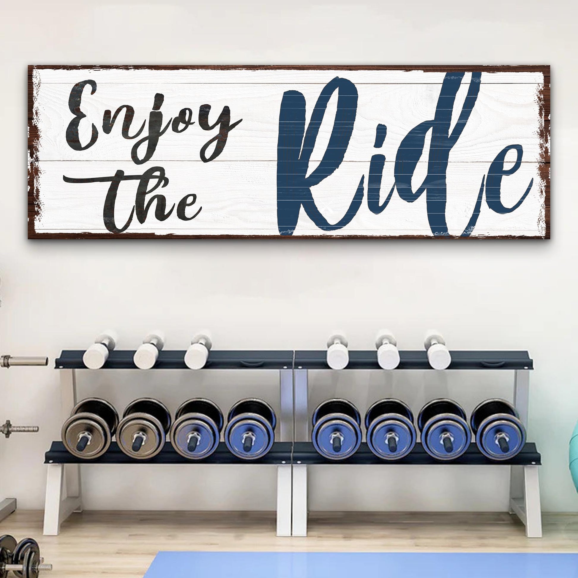Enjoy The Ride canvas sign by Tailored Canvases on white distressed wood with bold blue lettering on Tampa Home & Garden Store