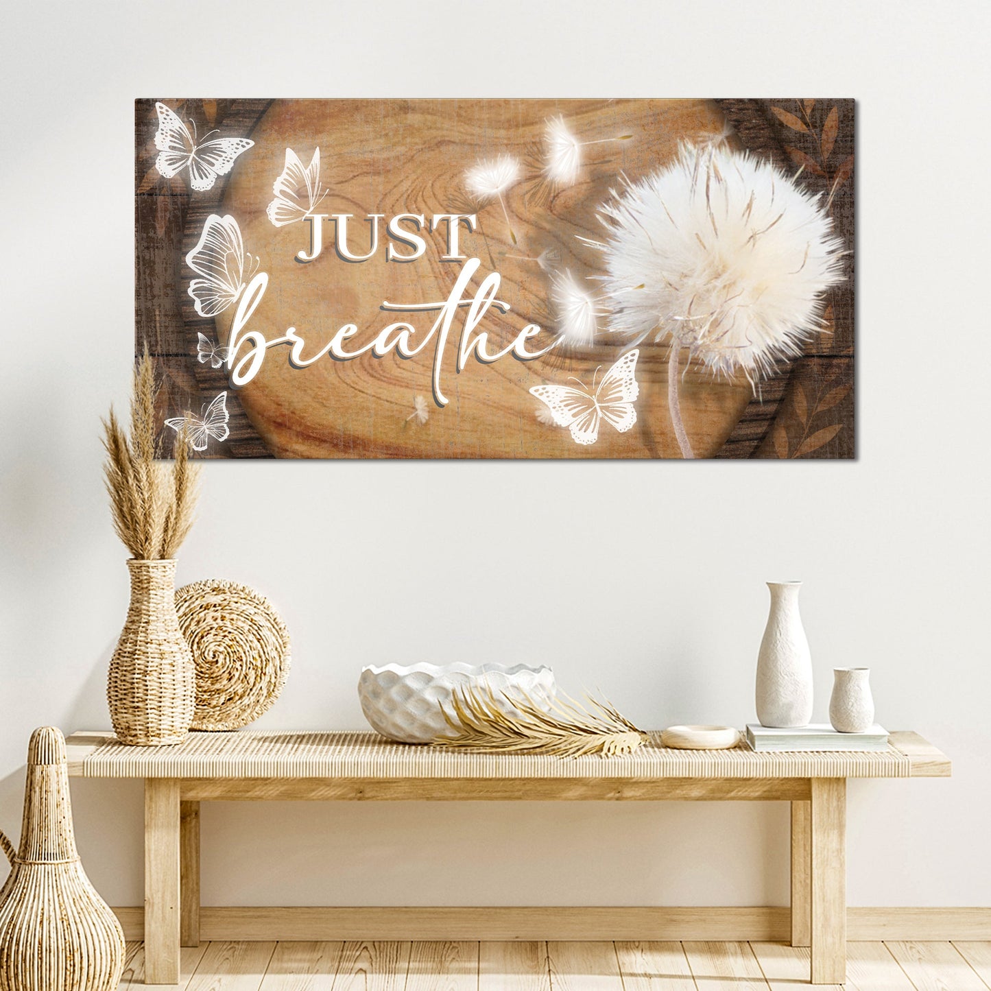 Just Breathe canvas sign by Tailored Canvases, wood-toned backdrop with white butterfly accents on Tampa Home & Garden Store