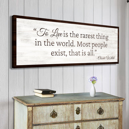 To Live Is The Rarest Thing Farmhouse Sign II canvas with distressed white backdrop and dark frame Tailored Canvases on Tampa Home & Garden Store