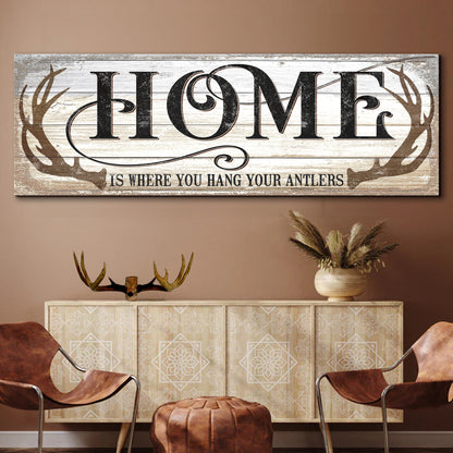 Home Is Where You Hang Your Antlers Sign II canvas with distressed whitewashed wood backdrop on Tampa Home & Garden Store