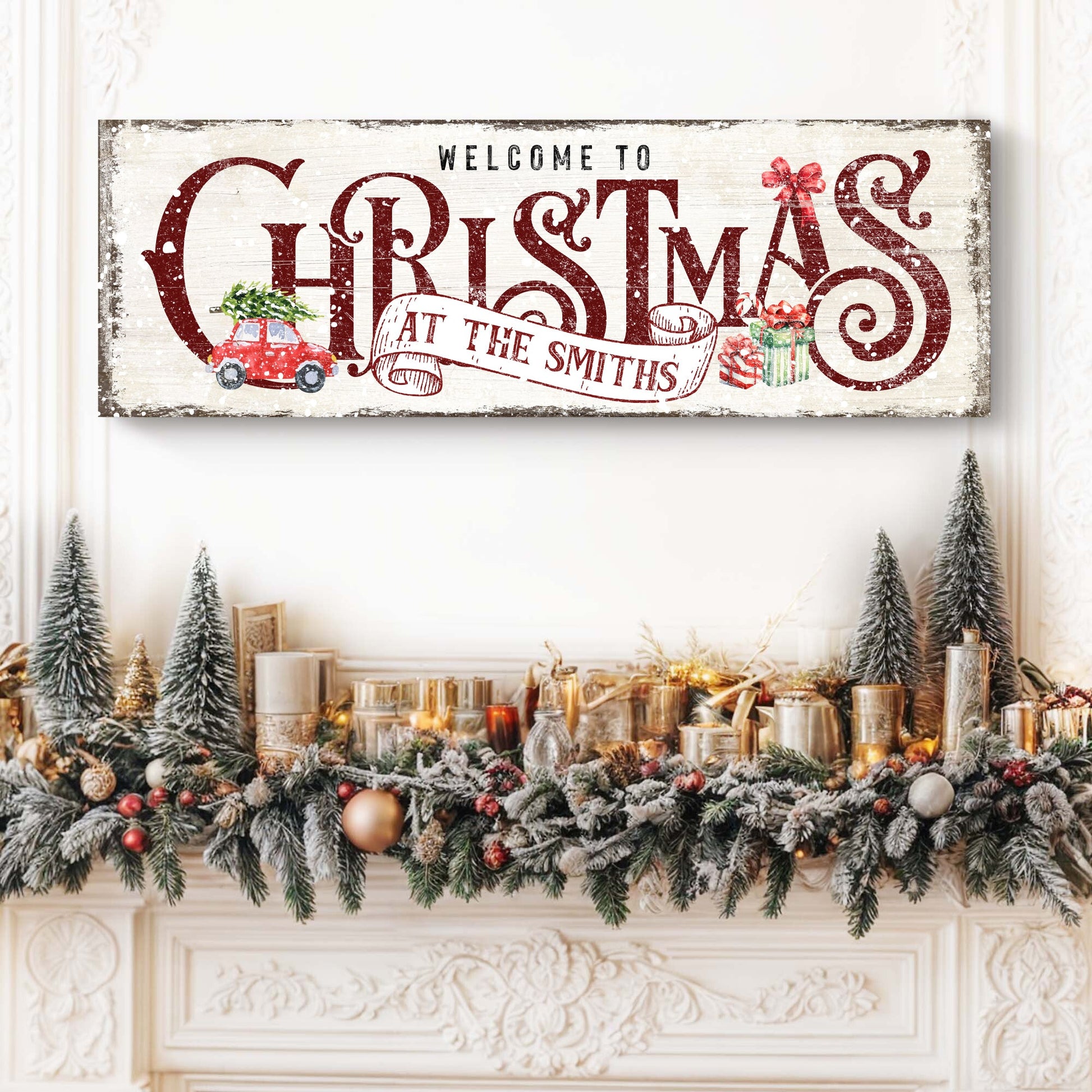 Family Welcome To Christmas Sign II canvas with distressed whitewash and bold red lettering, holiday garland on mantel on Tampa Home & Garden Store
