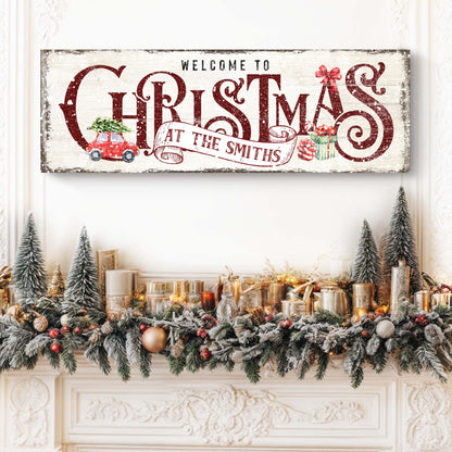 Family Welcome To Christmas Sign II canvas with distressed whitewash and bold red lettering, holiday garland on mantel on Tampa Home & Garden Store
