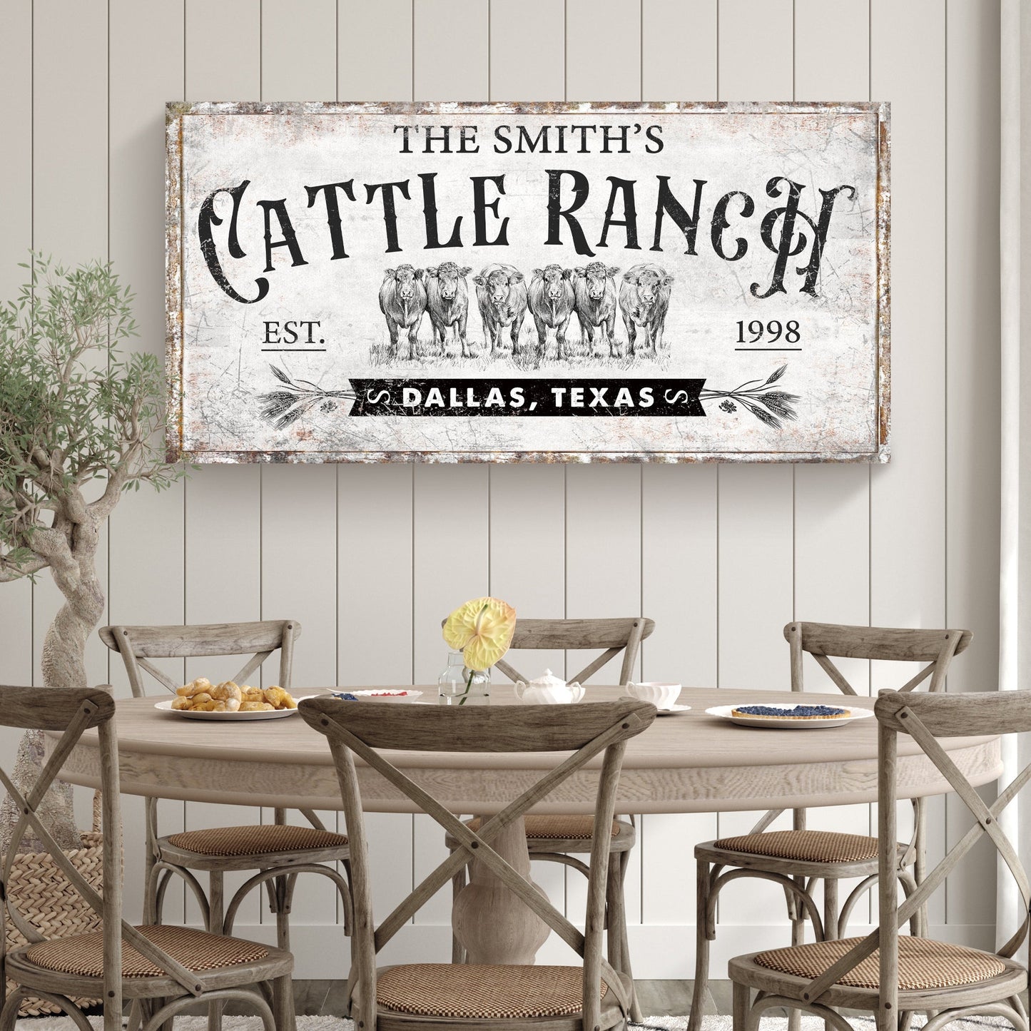Branded cattle ranch canvas sign with vintage typography and cow herd illustration on Tampa Home & Garden Store