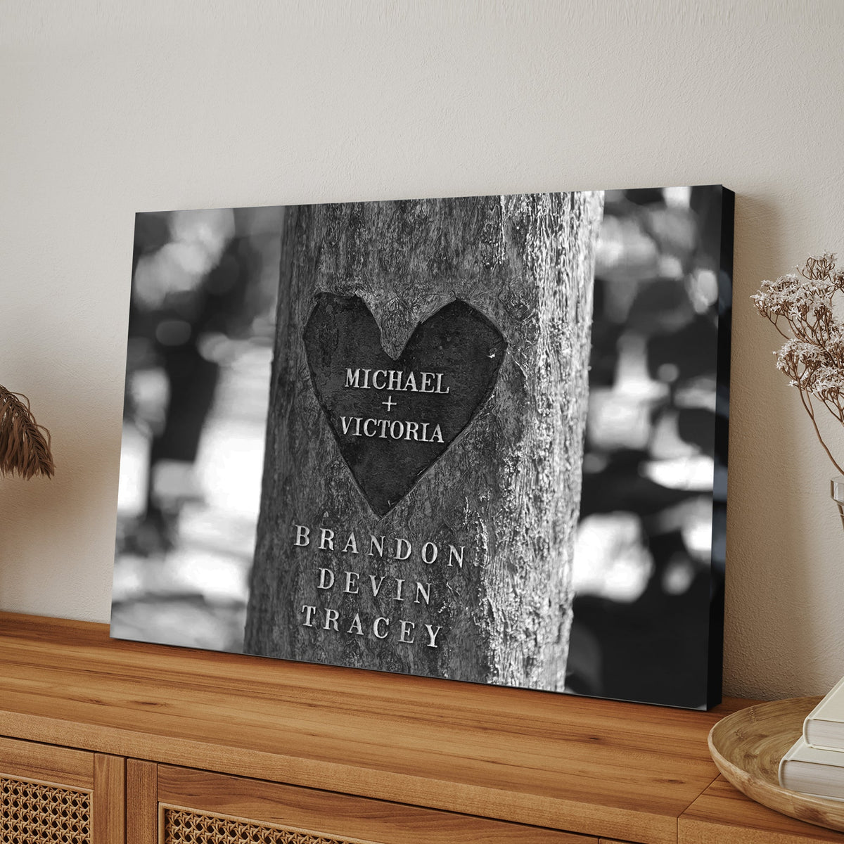 Tree Trunk Family Names Sign canvas with engraved names on bark texture monochrome on Tampa Home & Garden Store
