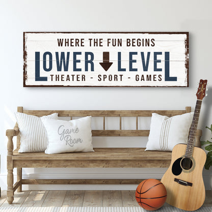 Canvas sign Lower Level home bar decor with bold blue letters on white wood plank backdrop on Tampa Home & Garden Store
