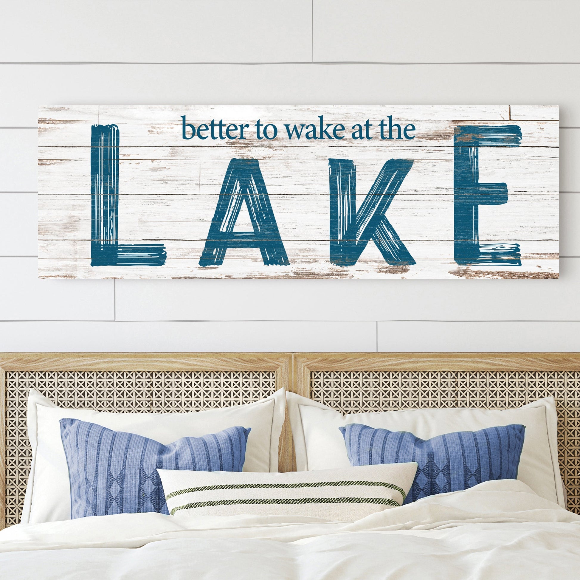 Better To Wake At The Lake Sign II canvas with distressed white wood background and bold blue LAKE lettering on Tampa Home & Garden Store